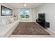 Spacious Gathering room with sectional sofa, TV, and large window with a scenic view at 3241 Wauseon Dr, St Cloud, FL 34772