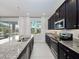 Spacious kitchen with granite island and stainless steel appliances at 3241 Wauseon Dr, St Cloud, FL 34772
