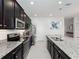 Modern kitchen with stainless steel appliances and granite countertops at 3241 Wauseon Dr, St Cloud, FL 34772