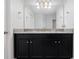 Bathroom features a double vanity with granite countertop and dark cabinets at 3241 Wauseon Dr, St Cloud, FL 34772