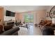 Living room with fireplace and sliding glass doors to patio at 5038 Downing St # 7, Orlando, FL 32839