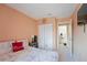 Bedroom with king-size bed, closet, and bathroom access at 5038 Downing St # 7, Orlando, FL 32839