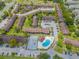 Community overview showcasing townhomes, pool, and parking at 5038 Downing St # 7, Orlando, FL 32839