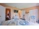 Bedroom with a view into another room, a dresser, and rocking chair at 5038 Downing St # 7, Orlando, FL 32839