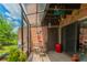 Relaxing screened patio with brick wall and seating at 5038 Downing St # 7, Orlando, FL 32839