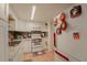 White kitchen with granite countertops and appliances at 5038 Downing St # 7, Orlando, FL 32839