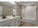 Clean bathroom with double vanity, tub, and shower at 155 Bull Frog Ln, Umatilla, FL 32784
