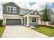 Two-story house with gray and green exterior at 155 Bull Frog Ln, Umatilla, FL 32784