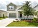 Two-story house with gray and green exterior at 155 Bull Frog Ln, Umatilla, FL 32784