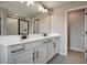 Elegant bathroom with double vanity, large mirror, and a walk-in shower at 155 Bull Frog Ln, Umatilla, FL 32784