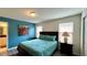 Bedroom with teal walls, a double bed, and window coverings at 2131 Tripoli Ct, Kissimmee, FL 34747