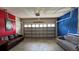 Finished garage with couches and additional storage at 2131 Tripoli Ct, Kissimmee, FL 34747