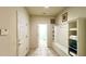 A view down a hallway featuring a built-in bench and storage at 2131 Tripoli Ct, Kissimmee, FL 34747