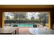 Screened pool and patio area with outdoor dining furniture at 2131 Tripoli Ct, Kissimmee, FL 34747