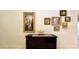 Wall with framed artwork and a decorative gold fish sculpture at 2131 Tripoli Ct, Kissimmee, FL 34747