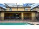 Outdoor patio with covered lanai and pool access at 2131 Tripoli Ct, Kissimmee, FL 34747