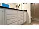 Bathroom with white cabinets and granite countertop at 2131 Tripoli Ct, Kissimmee, FL 34747