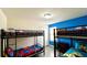 Bedroom with two bunk beds and colorful bedding at 2131 Tripoli Ct, Kissimmee, FL 34747