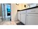 Bathroom with white cabinets and granite countertop at 2131 Tripoli Ct, Kissimmee, FL 34747