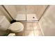 Bathroom with toilet and shower with glass enclosure at 2131 Tripoli Ct, Kissimmee, FL 34747