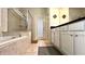 Bathroom with soaking tub, walk-in shower, and tiled floors at 2131 Tripoli Ct, Kissimmee, FL 34747