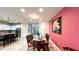 Dining area with table and chairs adjacent to the kitchen at 2131 Tripoli Ct, Kissimmee, FL 34747