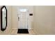 Home entryway with mirror and door to the interior at 2131 Tripoli Ct, Kissimmee, FL 34747