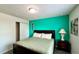 Bedroom with teal walls and double bed at 2131 Tripoli Ct, Kissimmee, FL 34747