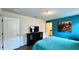 Bedroom with teal walls, double bed, and a dresser at 2131 Tripoli Ct, Kissimmee, FL 34747