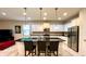 Modern kitchen featuring granite countertops, stainless steel appliances, and an island with seating at 2131 Tripoli Ct, Kissimmee, FL 34747
