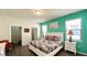 Main bedroom with a king-size bed and teal walls at 2131 Tripoli Ct, Kissimmee, FL 34747