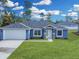 Newly built home with a two-car garage and landscaped yard at 16617 Sw 31St Cir, Ocala, FL 34473