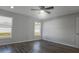 Well lit bedroom with hardwood floors and two windows at 16617 Sw 31St Cir, Ocala, FL 34473