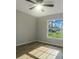 Spacious bedroom with large window and ceiling fan at 16617 Sw 31St Cir, Ocala, FL 34473