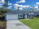 Newly built home with a two-car garage and landscaped yard at 16617 Sw 31St Cir, Ocala, FL 34473