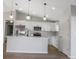 Modern kitchen with stainless steel appliances and an island at 16617 Sw 31St Cir, Ocala, FL 34473