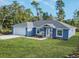 Newly built home with a two-car garage and landscaped yard at 16617 Sw 31St Cir, Ocala, FL 34473