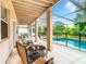 Covered patio overlooking a refreshing pool at 844 Suffolk Pl, Davenport, FL 33896
