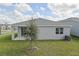 Single-Gathering home with grassy backyard and covered patio at 2319 Jagger Ln, Eagle Lake, FL 33839