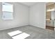 Bright bedroom with carpet flooring and ensuite bathroom access at 2319 Jagger Ln, Eagle Lake, FL 33839
