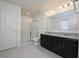 Elegant bathroom with double sink vanity and large walk-in shower at 13712 Summerport Village Pkwy, Windermere, FL 34786
