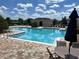 Community pool with plenty of seating at 13712 Summerport Village Pkwy, Windermere, FL 34786