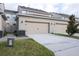 Shared driveway and garage view at 13712 Summerport Village Pkwy, Windermere, FL 34786