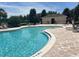 Inviting community pool with lounge chairs and a shaded area at 13712 Summerport Village Pkwy, Windermere, FL 34786