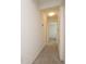Long hallway with carpet and neutral walls at 13712 Summerport Village Pkwy, Windermere, FL 34786