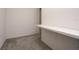 Simple hallway with a floating shelf and neutral-colored carpet at 13712 Summerport Village Pkwy, Windermere, FL 34786