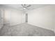 Spacious bedroom with gray carpet and ceiling fan at 3999 Meandering Bay Dr, Apopka, FL 32712