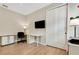 Home office with white desk and chair, and large closet at 668 Cordoba Dr, Davenport, FL 33837
