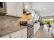 Modern kitchen with granite countertops and stainless steel appliances at 668 Cordoba Dr, Davenport, FL 33837