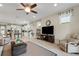Open living space with TV, recliner, and view of kitchen at 668 Cordoba Dr, Davenport, FL 33837
